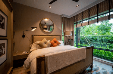 Bedroom with a view of lush greenery outside