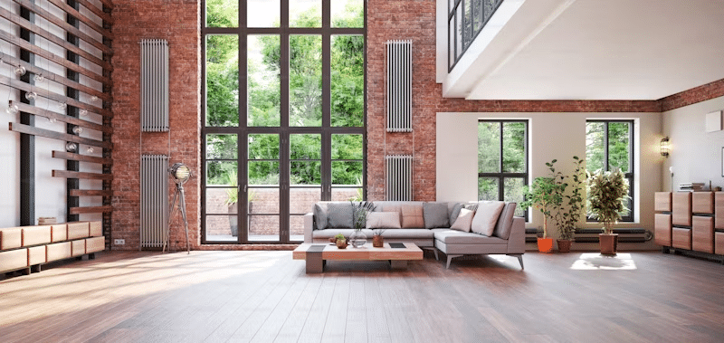 Open concept industrial loft living area with a couch